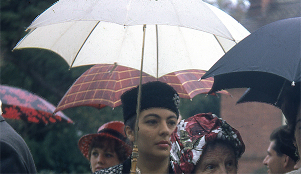 Sample scan - colour restored and digital ice applied scan of a  woman at a wedding under a umbrella